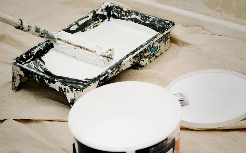 paint roller and tray with water-based paint, a lower-hazard alternative to solvent-based paint