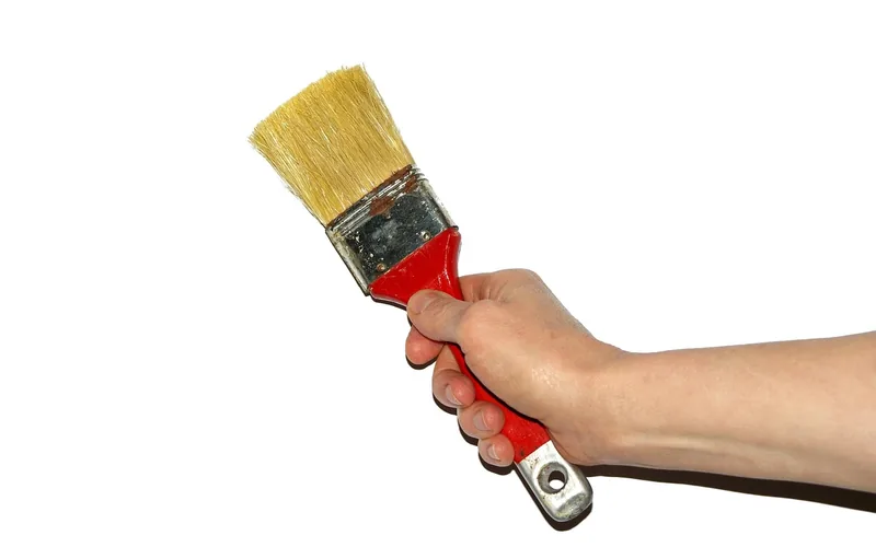 Paintbrush loaded with oil-based paint, the kind of cleanup job mineral spirits handle best Paintbrush loaded with oil-based paint, the kind of cleanup job mineral spirits handle best