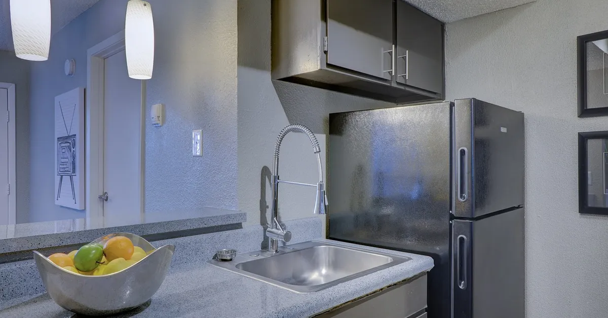 Clean kitchen counter and sink after removing a stain from a Formica-style countertop