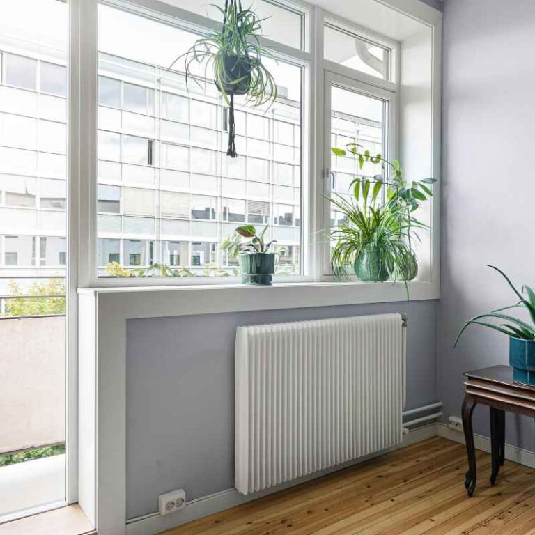 How Far Under A Window Should Baseboard Heaters Go?