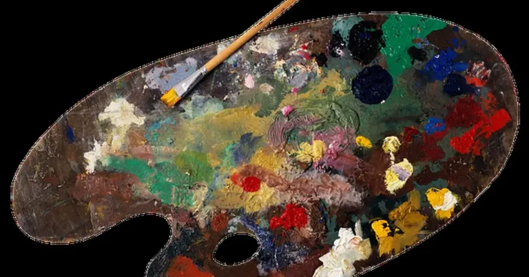 Artist palette with dark mixed paint colors and brush