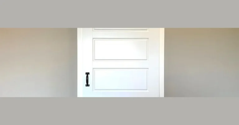 white barn door with a handle for locking