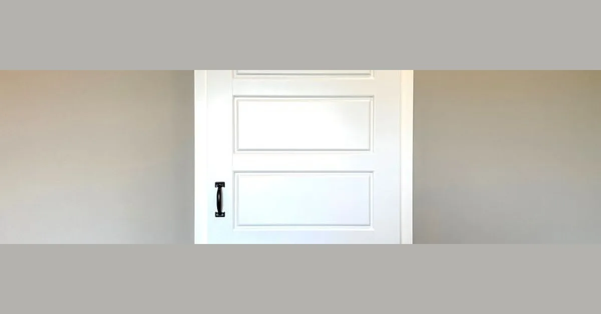 white barn door with a handle for locking