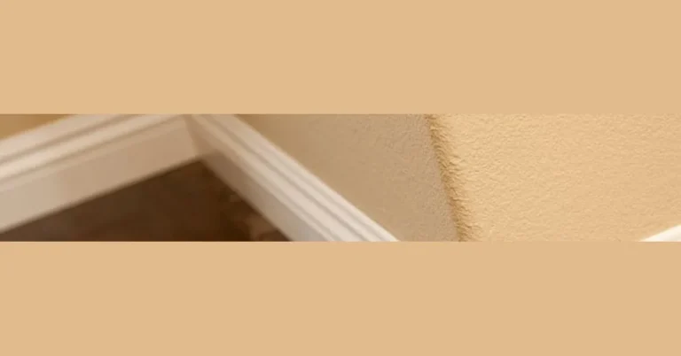 baseboard molding fitted against an uneven floor corner