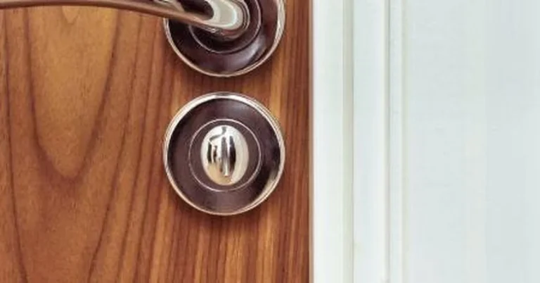 Bathroom door privacy lock with turn button release on the handle