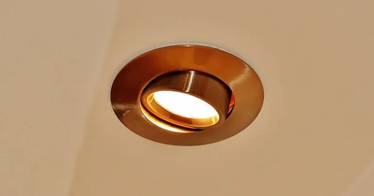 Close-up of a round LED recessed light fixture installed in a ceiling