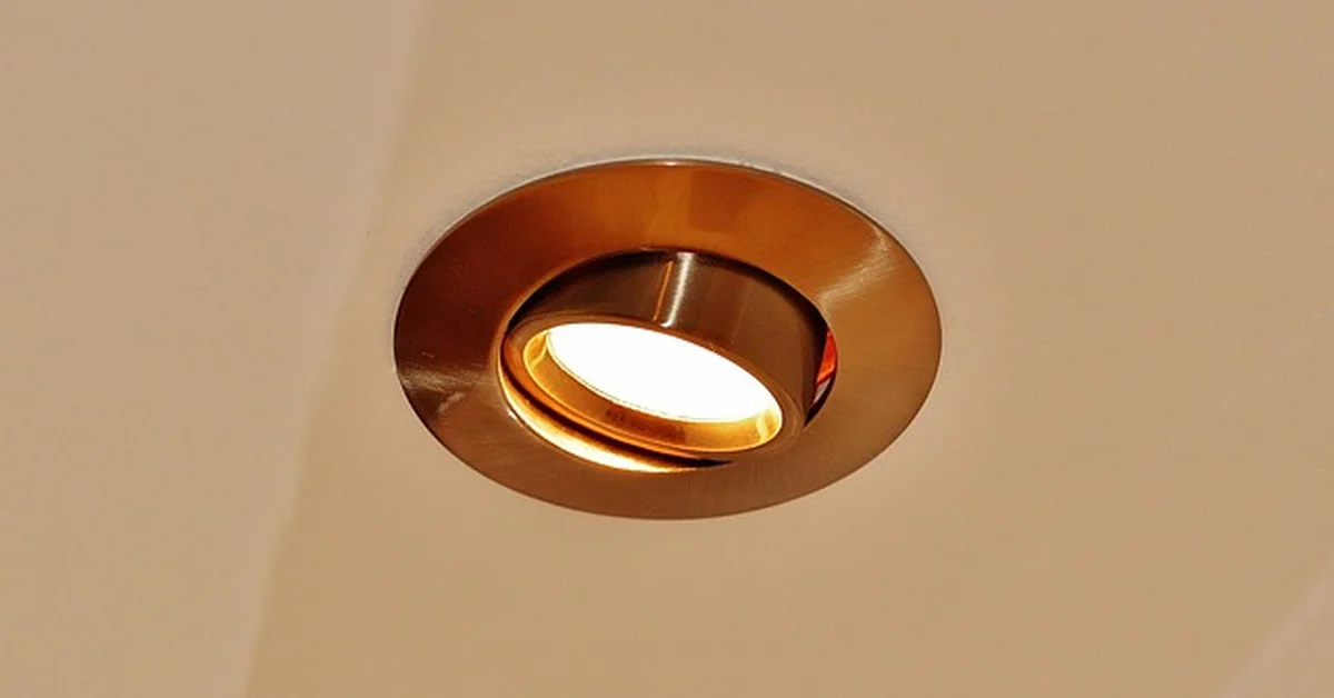 Close-up of a round LED recessed light fixture installed in a ceiling