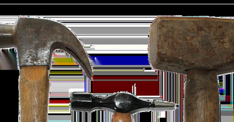 Claw hammer with metal head next to a wood mallet with a soft striking head