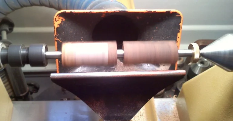 Wood lathe turning on a workshop workbench
