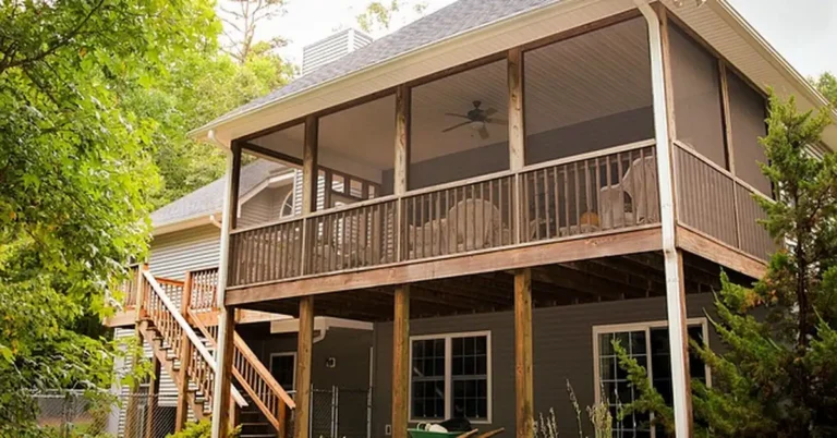 Two-level wood backyard deck built from a DIY decking kit with staircase