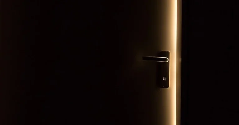 Light leaking through the gap around an unsealed exterior door threshold