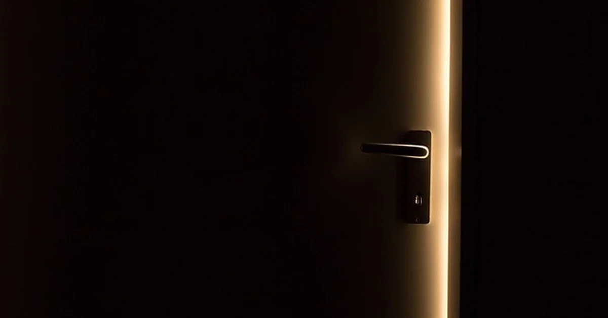 Light leaking through the gap around an unsealed exterior door threshold