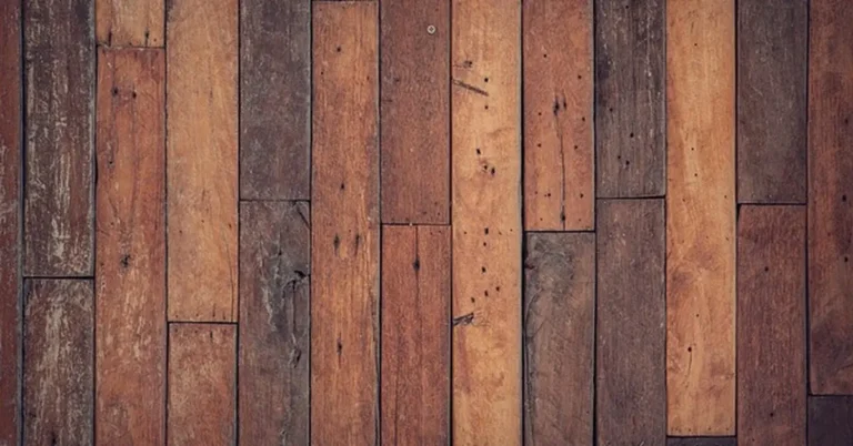 Hardwood floor planks showing scratches and wear before permanent repair