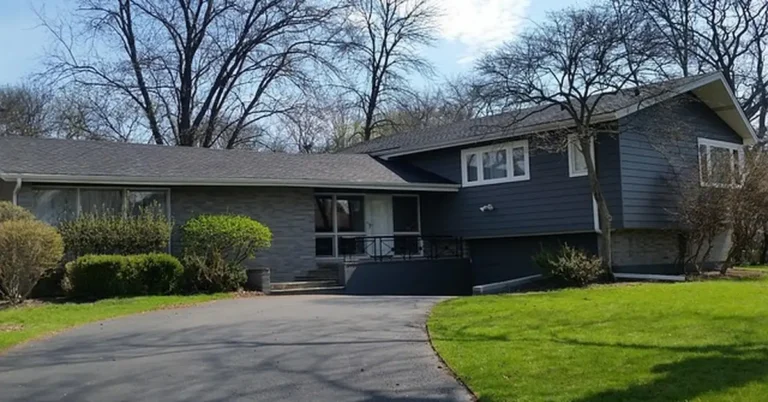 House exterior with freshly painted dark blue gray siding