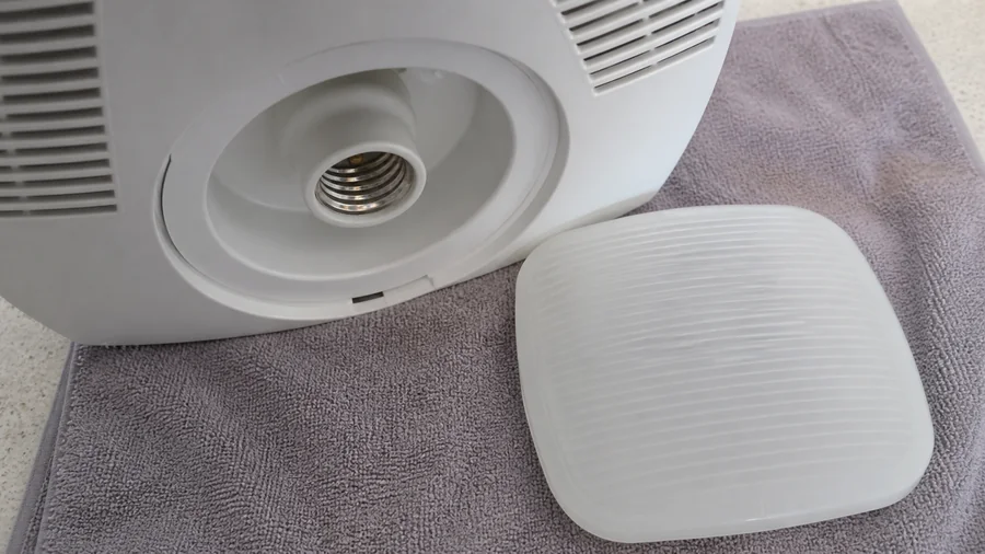 Bathroom exhaust fan light grille and bulb socket checked with power switched off