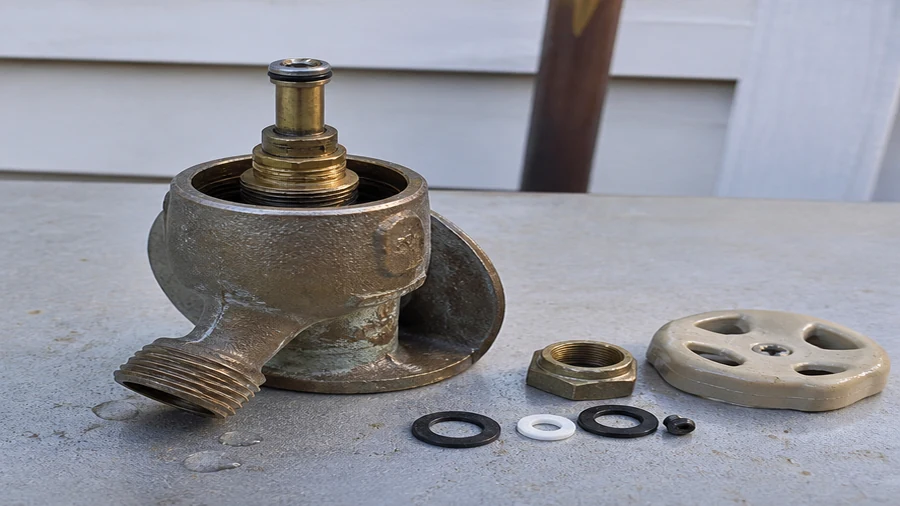 Prier-style outdoor faucet and repair parts checked during a leak diagnosis
