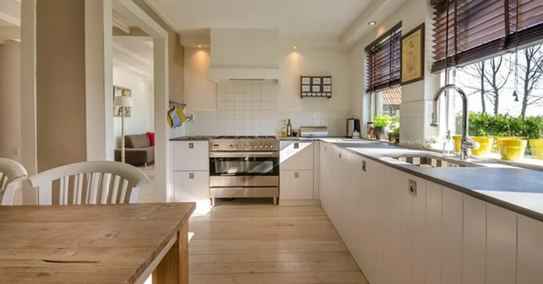 modern kitchen with flat solid countertop and white cabinets after a laminate resurfacing update