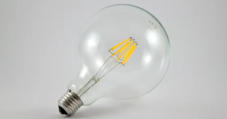 LED light bulb glowing, illustrating low heat output and fire hazard safety