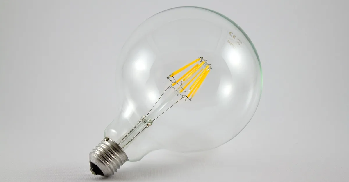 LED light bulb glowing, illustrating low heat output and fire hazard safety