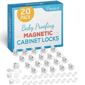 Magnetic childproof cabinet locks with keys installed inside a kitchen cabinet
