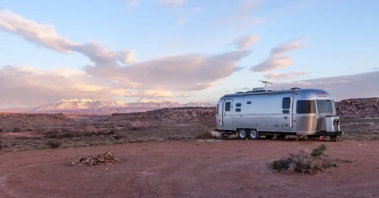 Mobile home trailer parked on a graded site, the kind of setup that needs tie-down anchors