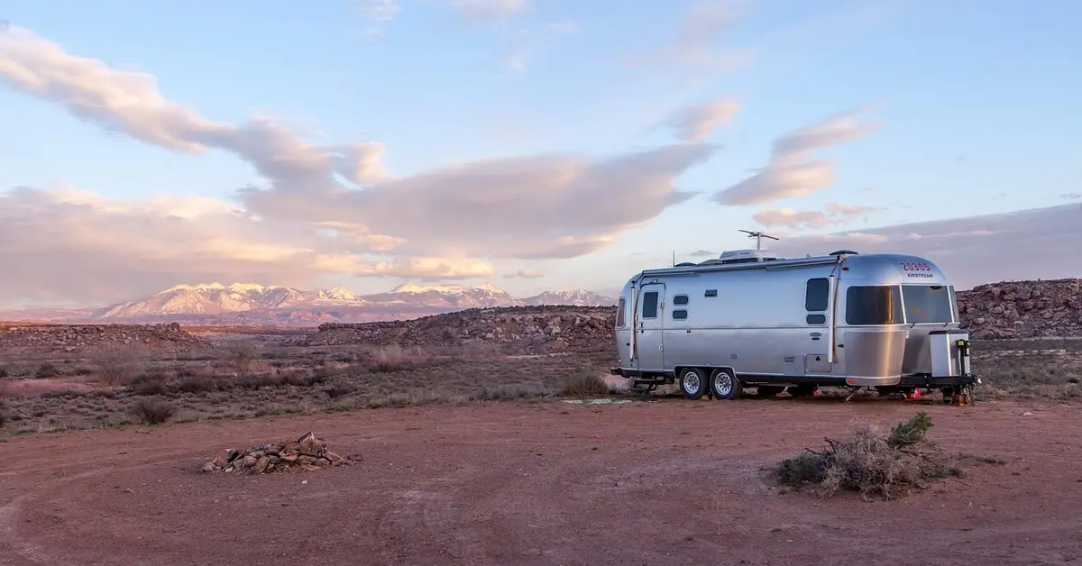 Mobile home trailer parked on a graded site, the kind of setup that needs tie-down anchors