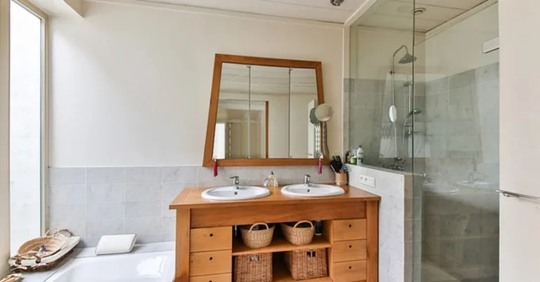 Finished bathtub with tiled alcove surround and glass shower installed