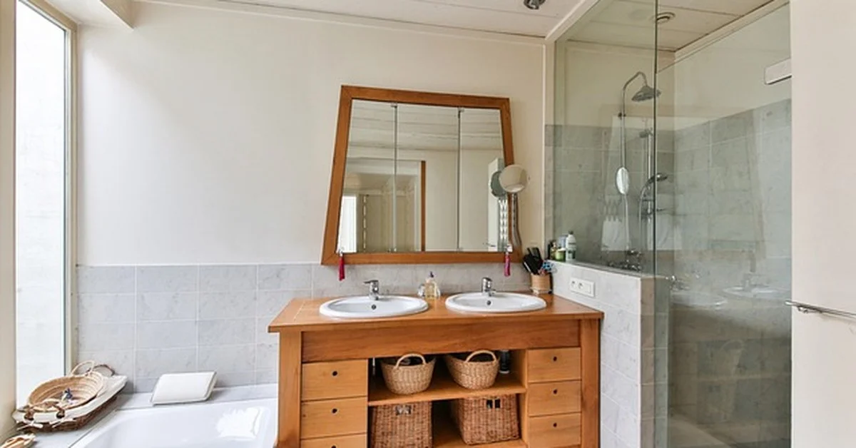 Finished bathtub with tiled alcove surround and glass shower installed