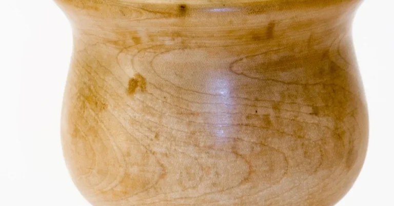 Olive wood mortar and pestle showing natural grain and food-safe finish