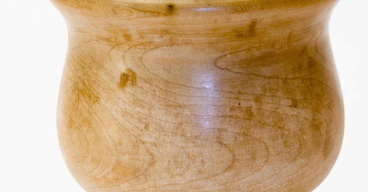 Olive wood mortar and pestle showing natural grain and food-safe finish