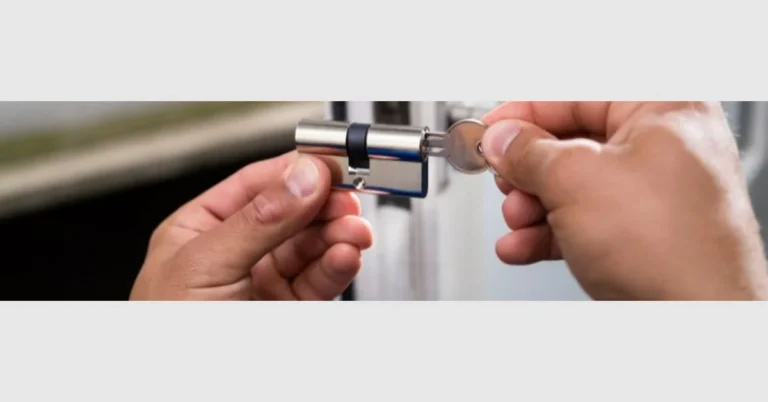 Hands installing a new lock cylinder into a patio door with key