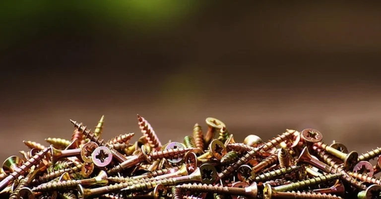 Pile of countersunk head wood screws with conical bugle heads