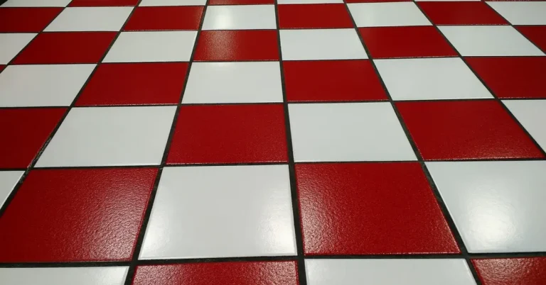 Red and white tile floor with visible grout lines between tiles
