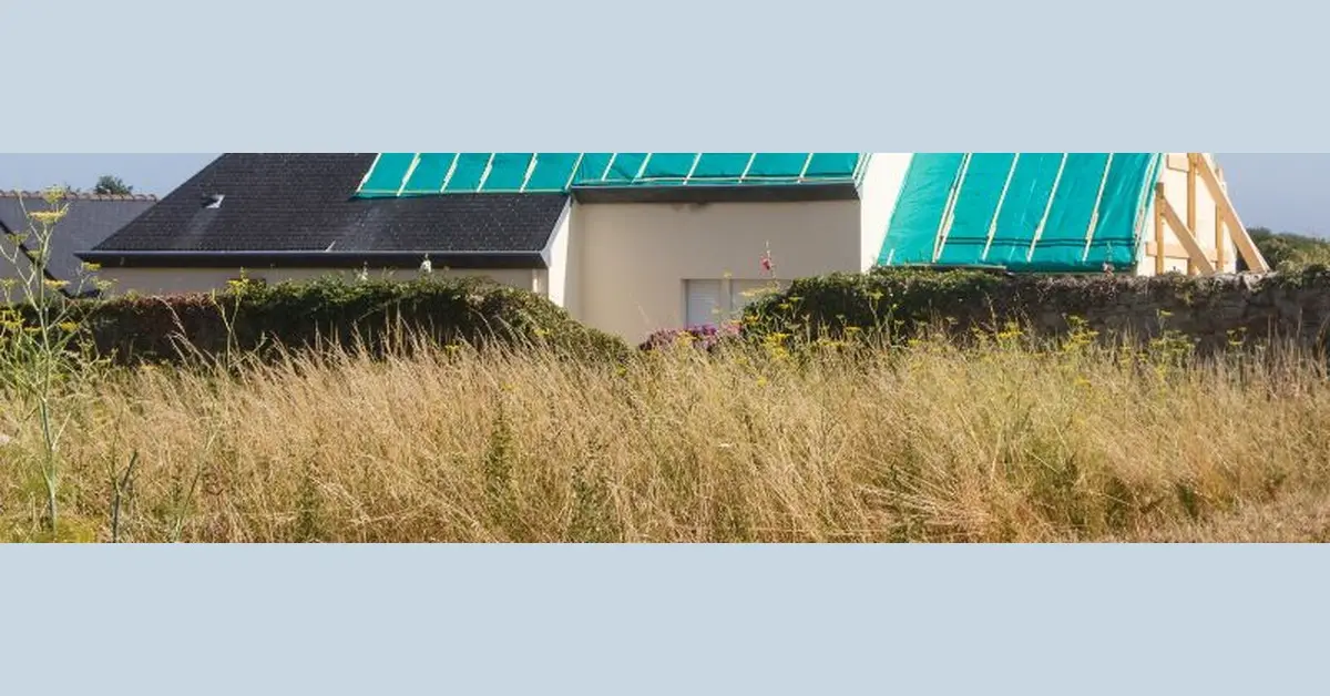green tarp attached to the side of a house