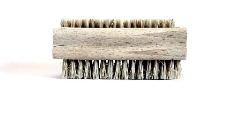 Stiff bristle scrub brush used to clean a toilet bowl and remove stains
