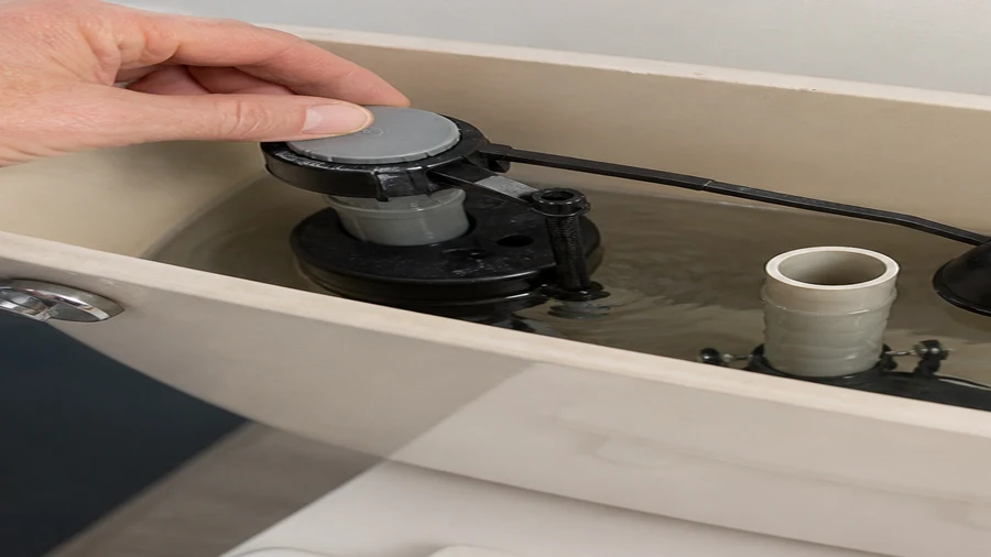 Fluidmaster-style fill valve checked inside a running toilet tank
