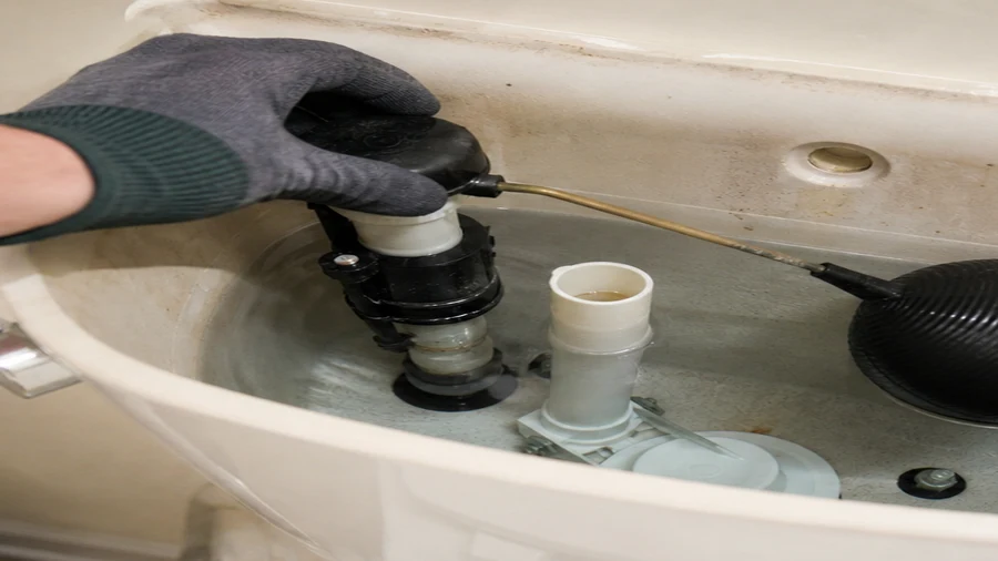 Ball-float toilet mechanism checked during an intermittent running-water diagnosis