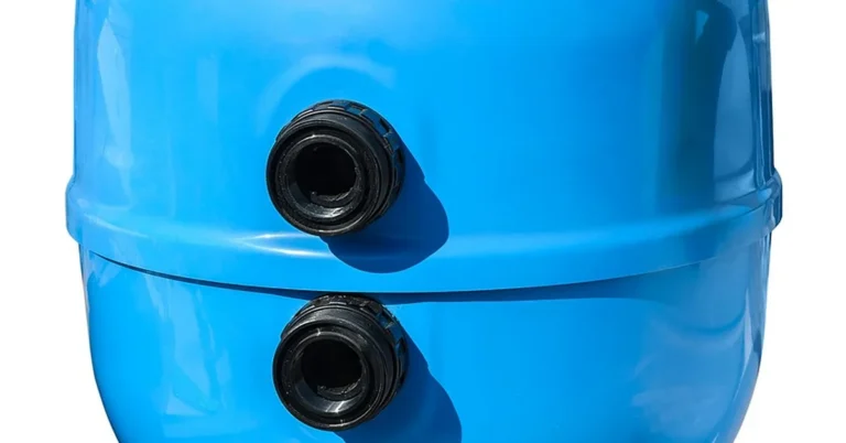 Blue canister-style water filtration tank used in whole-house filter installations
