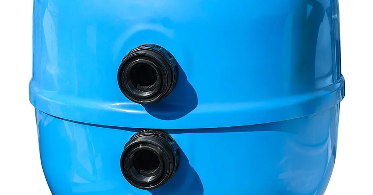 Blue canister-style water filtration tank used in whole-house filter installations