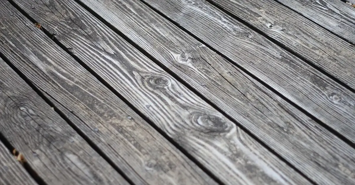 Weathered pressure treated deck boards before sealing