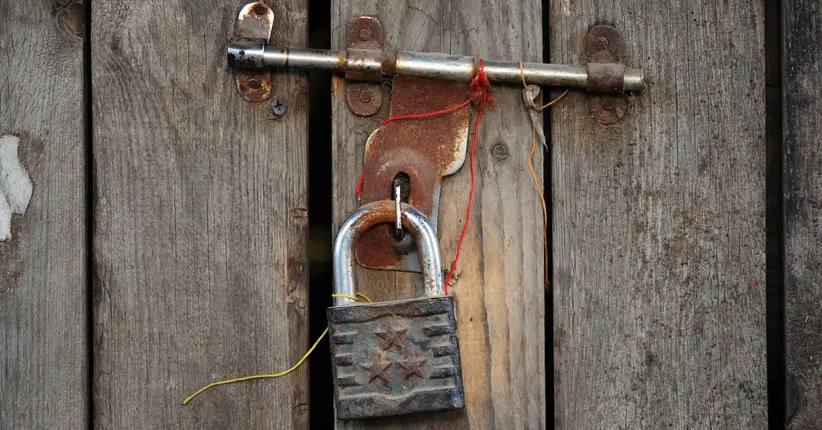 Door latch and handle hardware used to illustrate a stuck latch problem