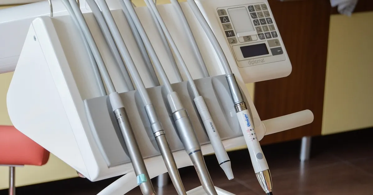 A set of metal drill bits used with a power drill.