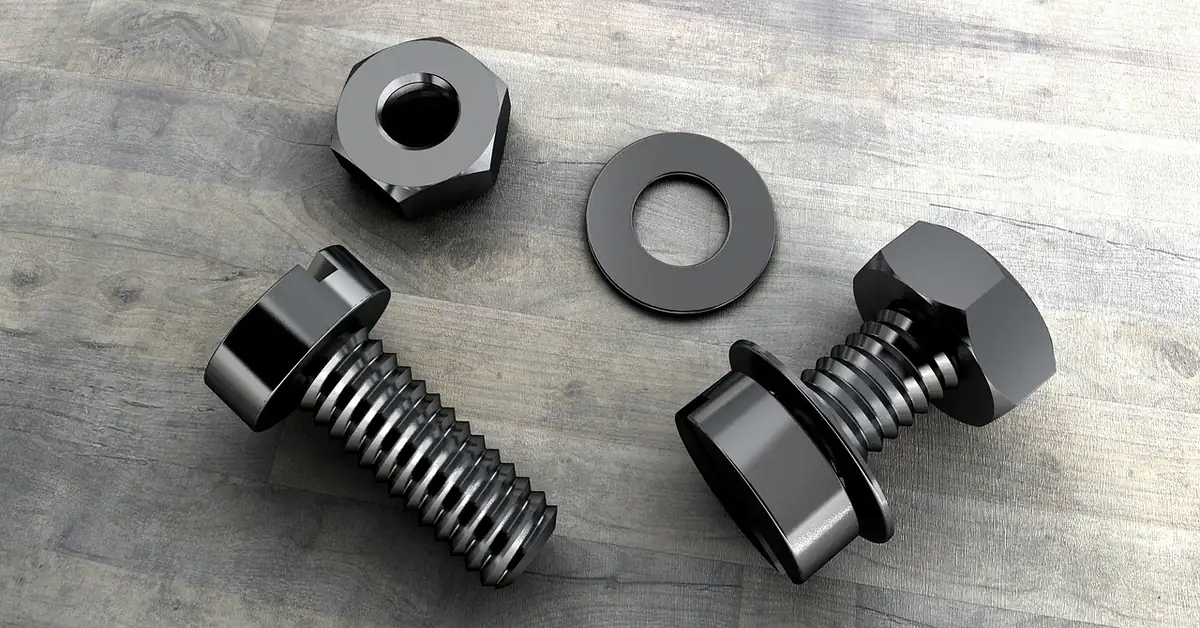 Drywall anchors and screws laid out for a wall fastening project