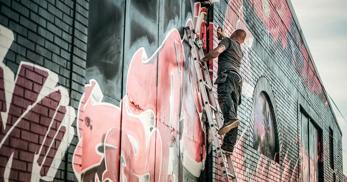 Primer being applied to a wall before painting