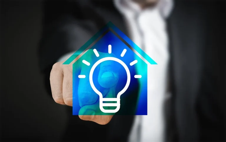 A person uses an iPhone in a bright living room with a smart speaker and tablet nearby