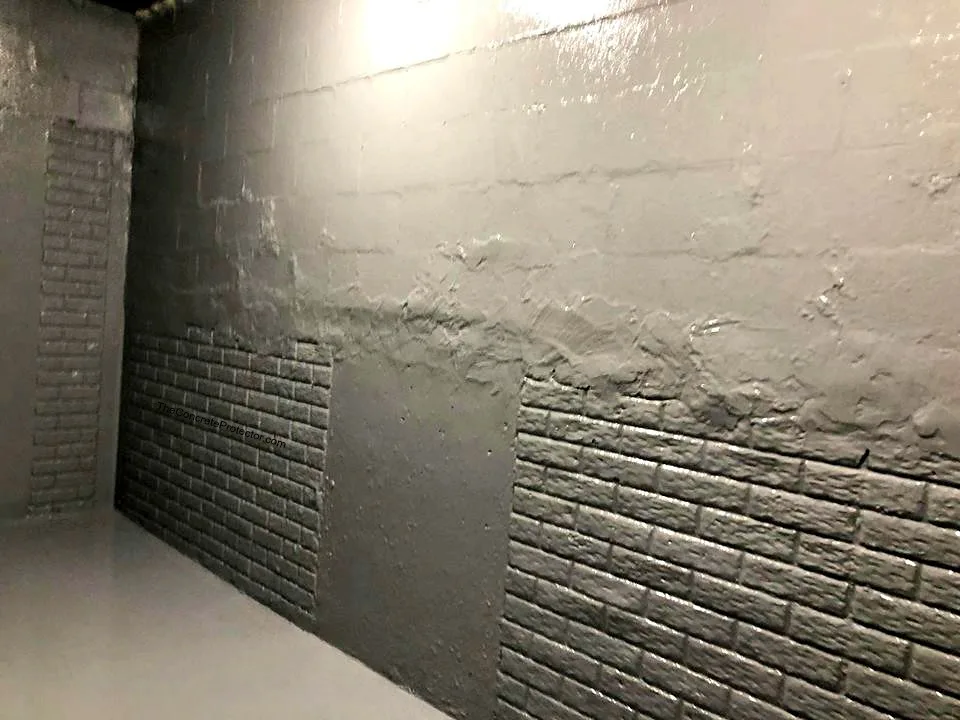 Basement waterproofing close-up of a wall crack, drain channel, and sump pump basin.