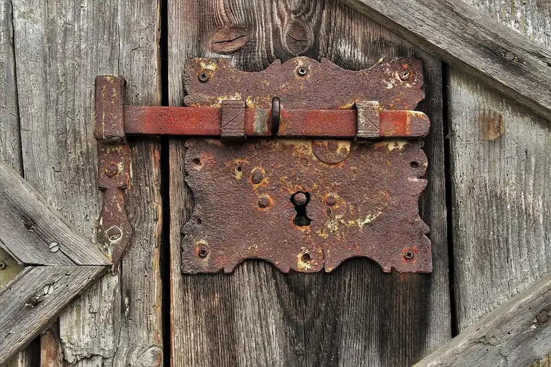 What is the best latch for a wood gate when the post is slightly out of plumb?