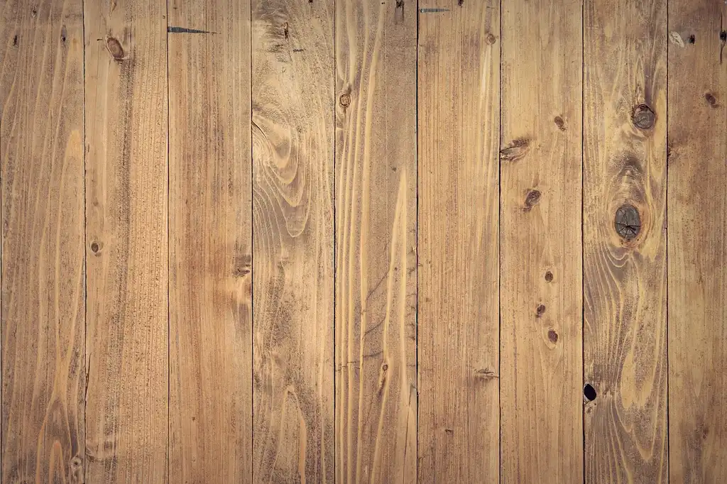 Microfiber flat mop on a light oak hardwood floor in natural window light