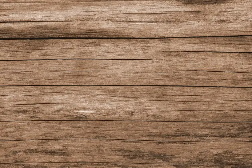 Furniture and trim samples in natural light on a workbench for comparing wood finishing oil options