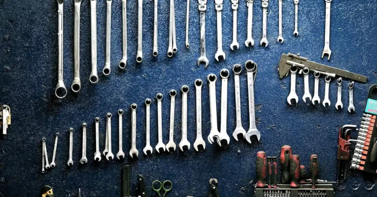 Hand tools neatly arranged in a workshop tool organizer